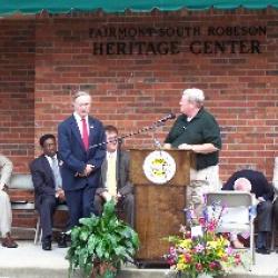 Town Manager Blake Proctor gives Mayor Charles Kemp the Certificate of Occupancy.
