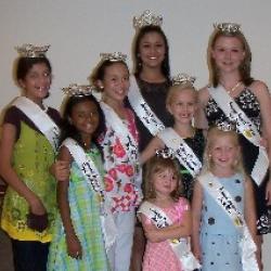 The Festival queens pose on the stage of the Heritage Center.