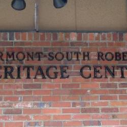 The sign on the front of the building.