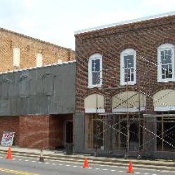 Stucco being applied to outside of building.
