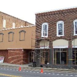 Stucco painted on lower side of Heritage Center. 